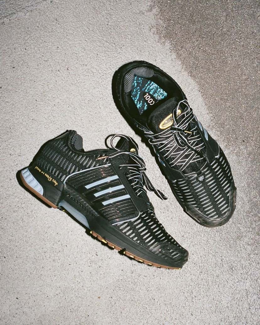 Par de adidas Climacool 1 negras de Always Do What You Should Do apoyadas sobre el asfalto