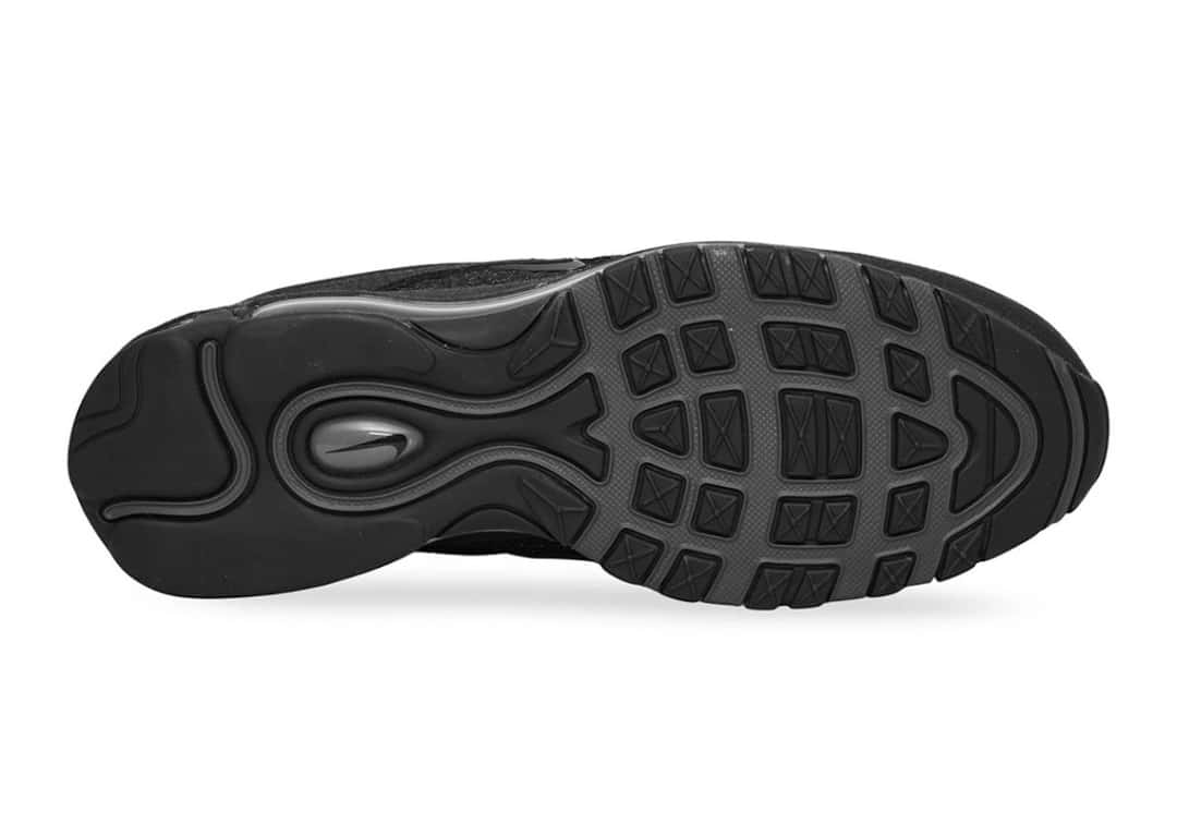 Suela de la Slam Jam x Nike Air Max 97, negra y gris oscuro, con el dibujo de tracción de la 97 y el logo de Nike en el centro